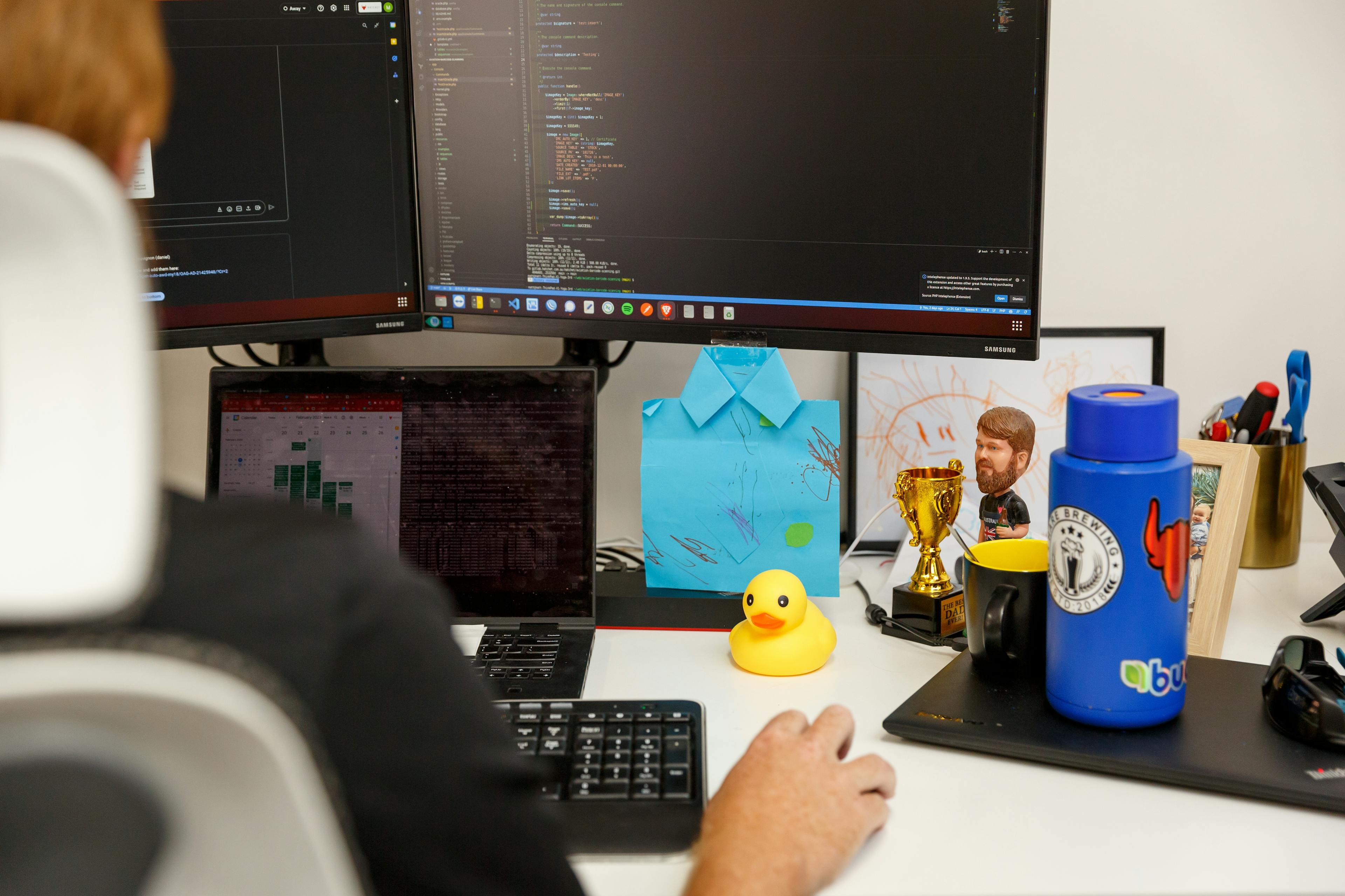 a person is sitting at a desk in front of a computer .